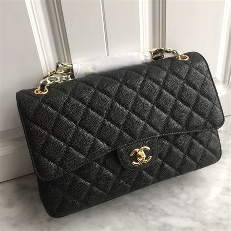 chanel black gold bag|Black Chanel jumbo flap bag.